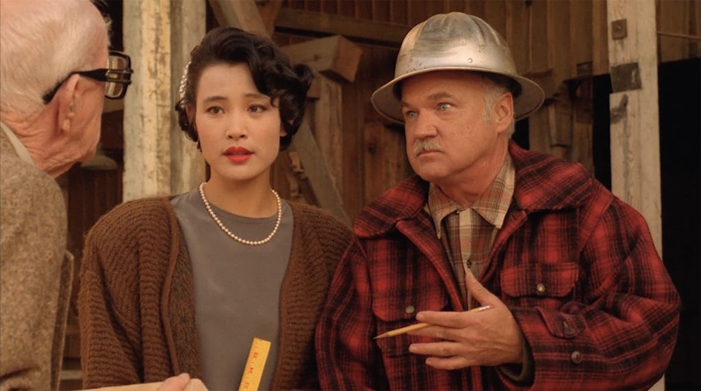 Dell Mibler, Josie Packard and Pete Martell discussing wood