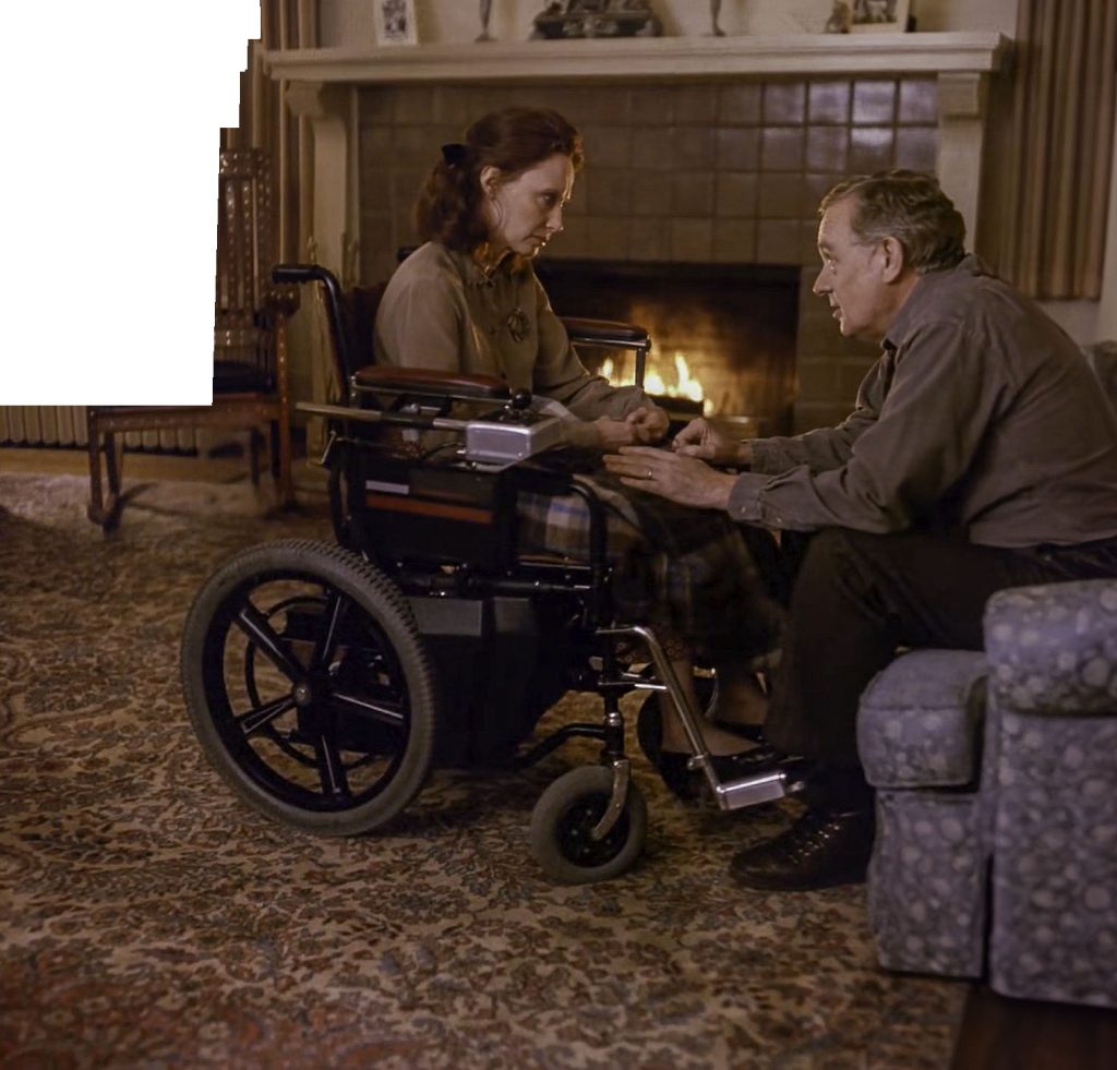 Eileen and Will Hayward speaking in the living room