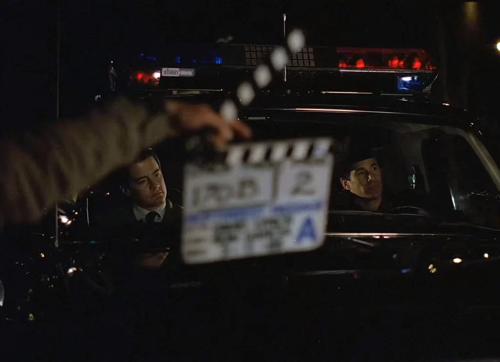 Clapboard in front of Twin Peaks Sheriff's Department Vehicle