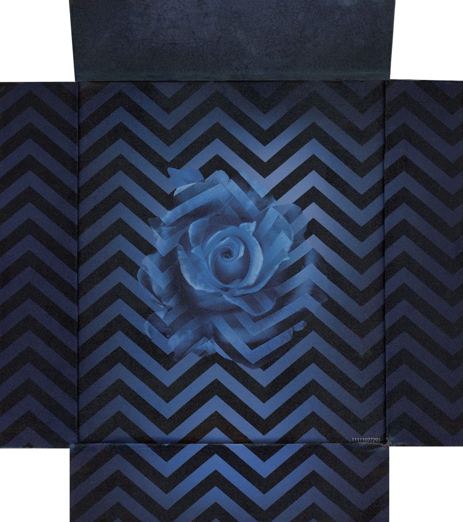 Back Cover of the Twin Peaks: The Entire Mystery Blu-ray set with a blue rose