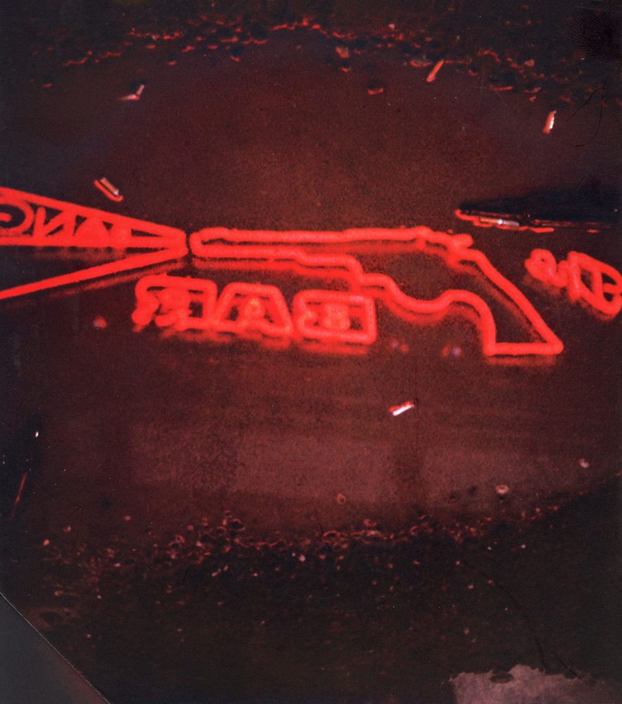 Reflection of neon Bang Bang Bar sign from The Twin Peaks: The Entire Mystery Blu-ray set