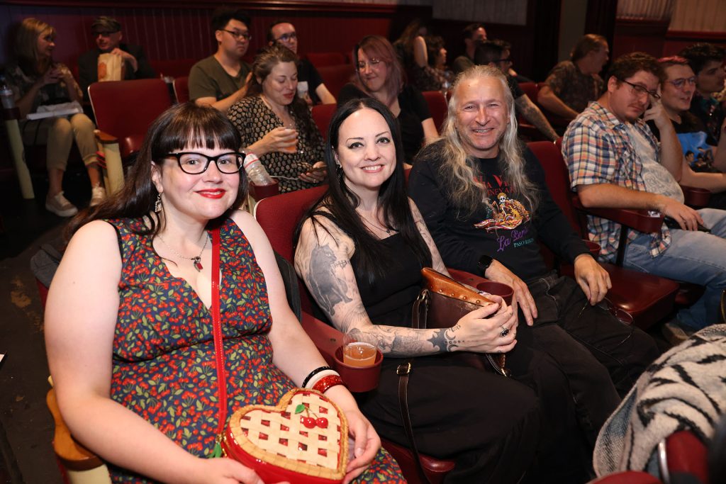 Three people in a movie theatre