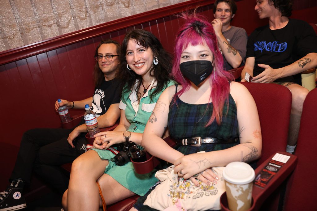 Three people in a movie theatre