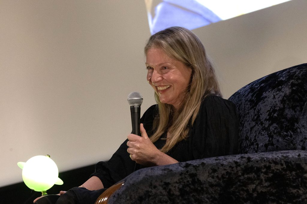 Sheryl Lee on stage with a microphone