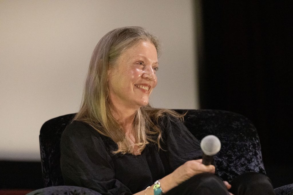 Sheryl Lee on stage with a microphone