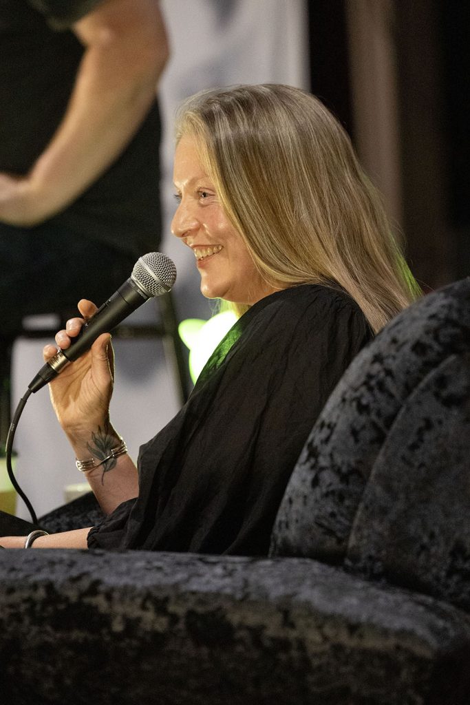 Sheryl Lee on stage with a microphone