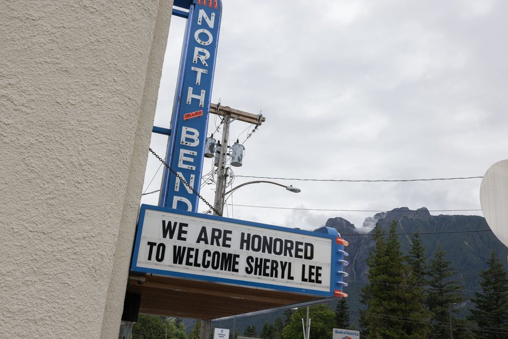 Exterior of North Bend Theatre marquee with Mount Si in the distance