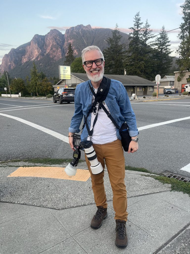 Steven standing in front of Mount Si with camera gear