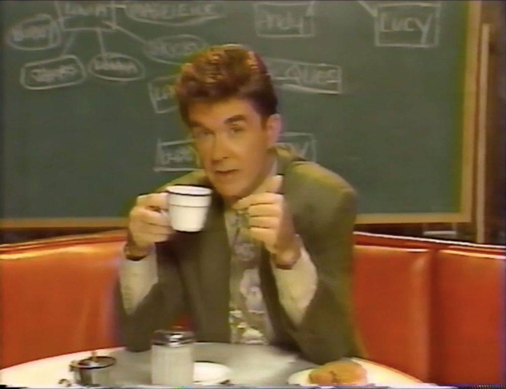 Alan Thicke holding a cup of coffee