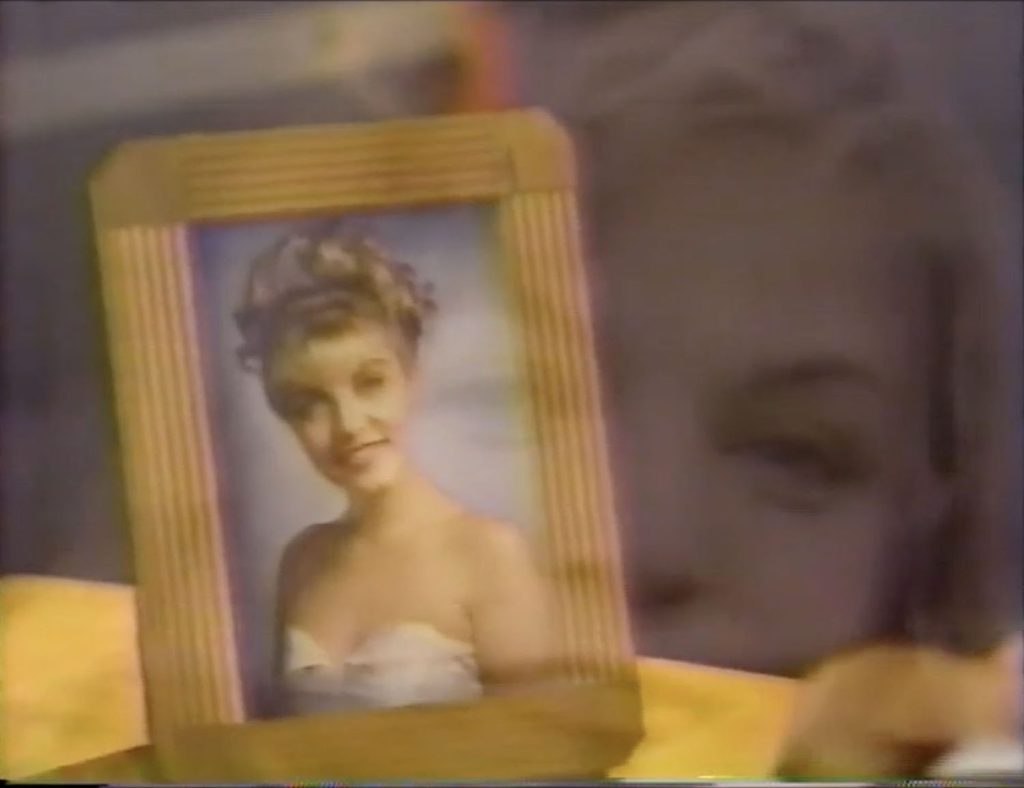 Framed photo of Laura Palmer superimposed shot of Laura from picnic video.