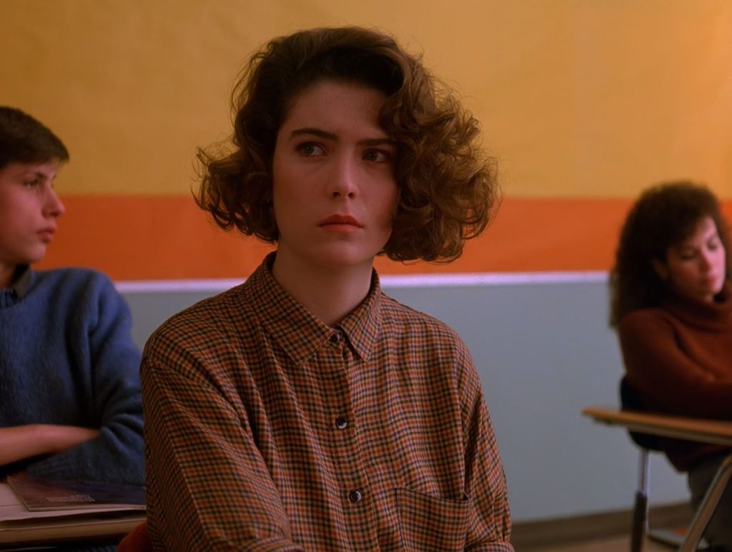 Donna Hayward sitting in a classroom