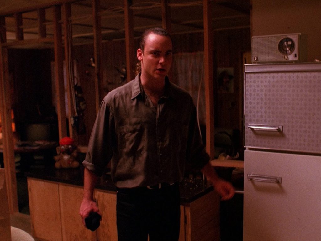 Leo Johnson holding a sock with soap in the kitchen