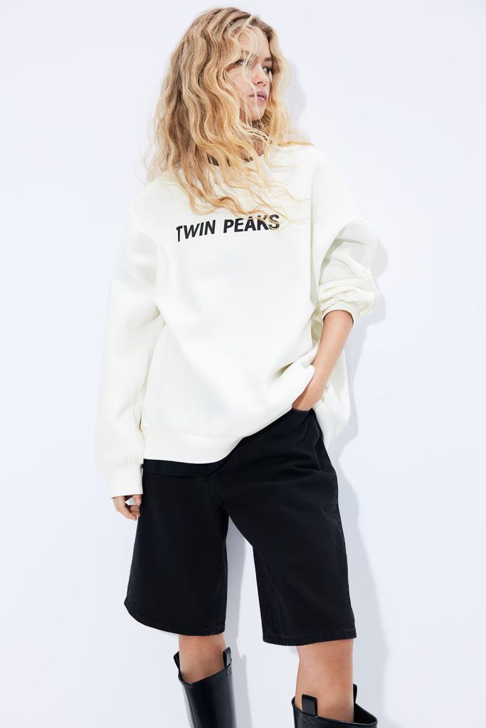 Blonde model wearing Twin Peaks sweatshirt