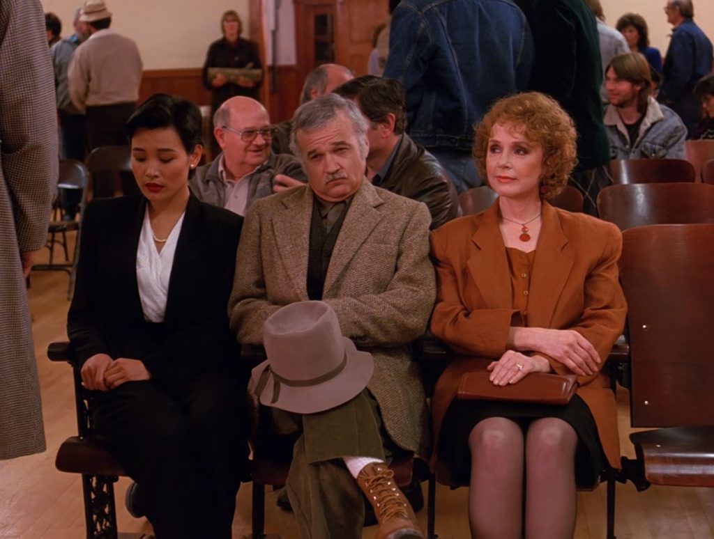 Guy seated behind Josie Packard in the Twin Peaks Pilot