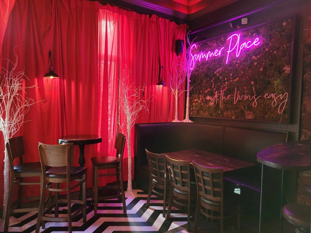 Inside ofThe Summer Place Bar with Red Drapes