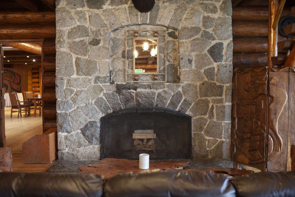 Stone fireplace at Kiana Lodge