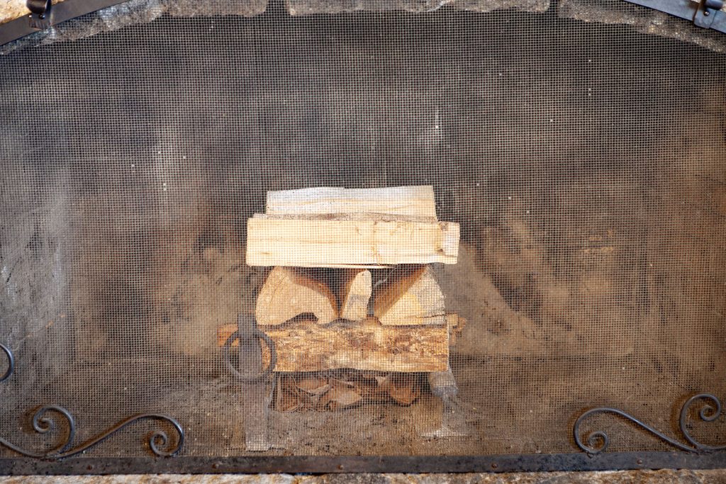 Logs stacked inside a fireplace