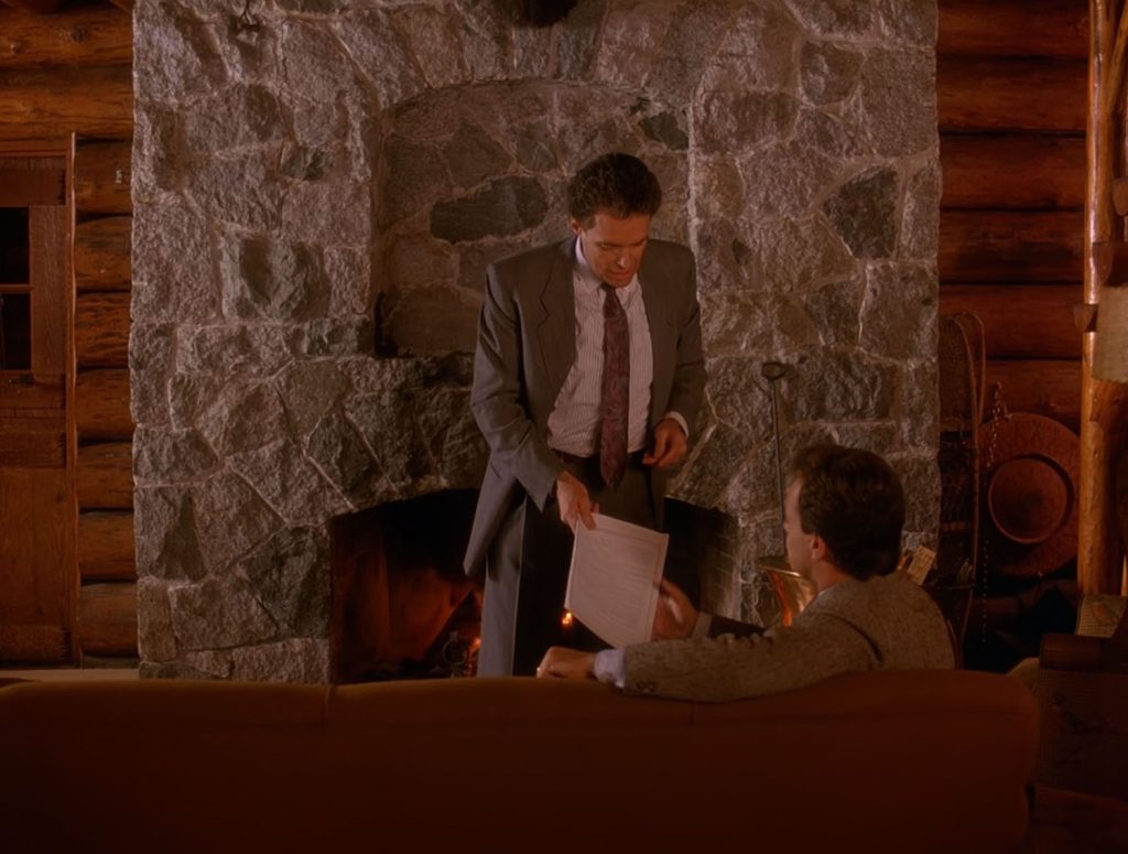 Ben Horne handing a contract to Leland Palmer