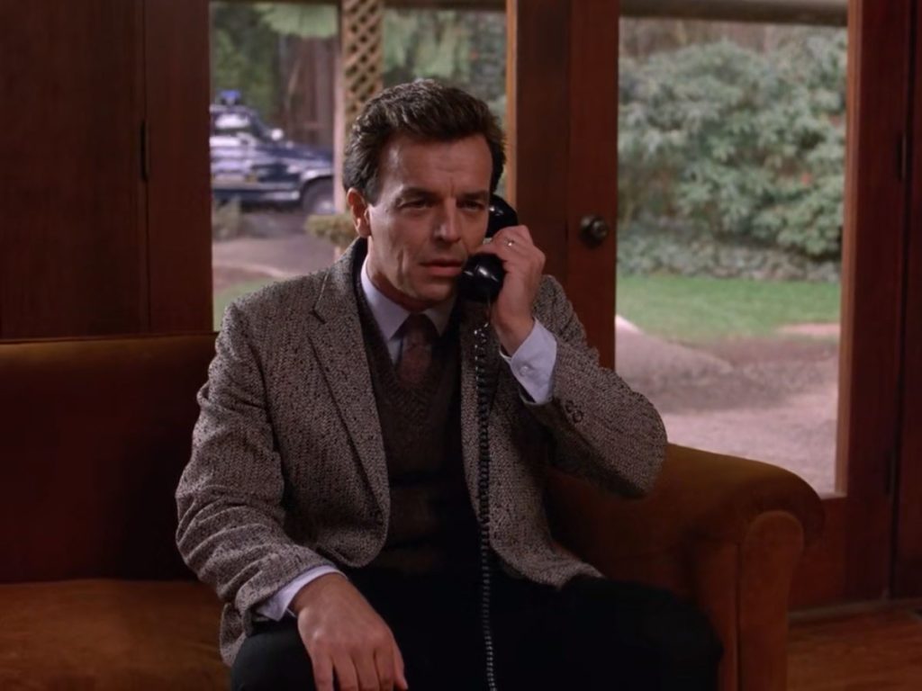 Leland Palmer sitting in the Great Northern Hotel on the telephone