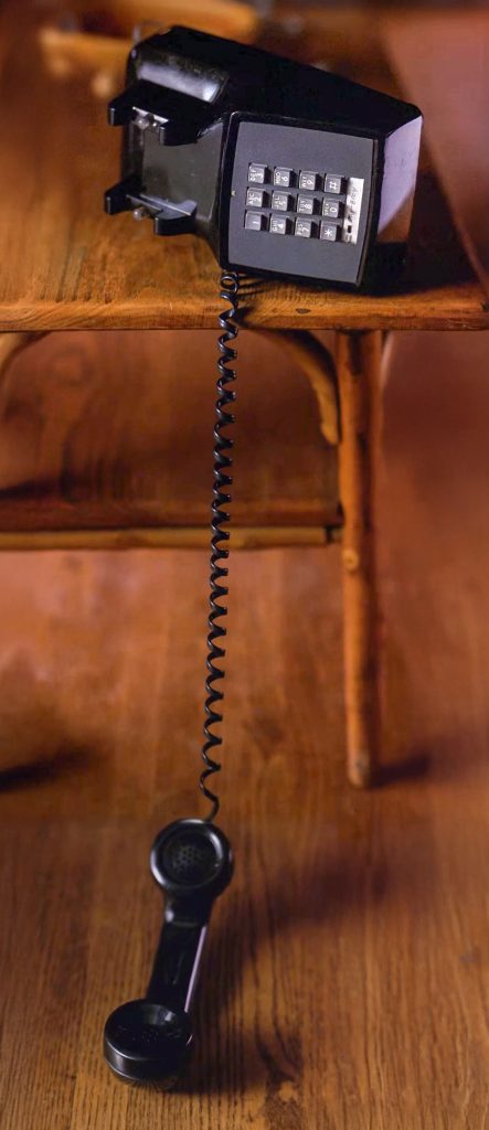 Black telephone on a table