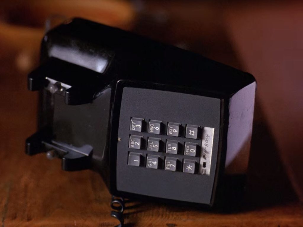 Black telephone on a table