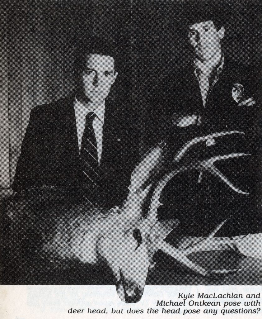 Agent Cooper and Sheriff Truman by a fallen deer head