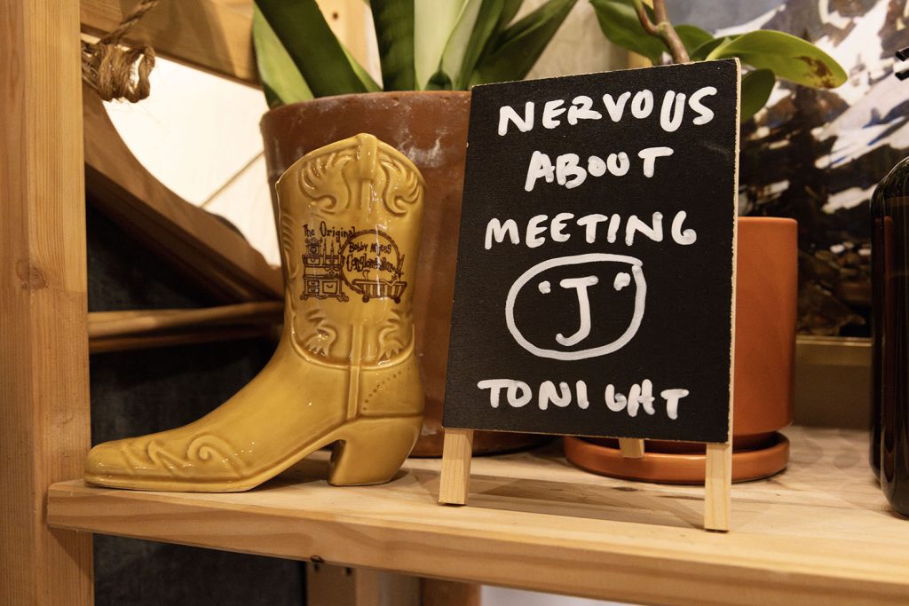 Ceramic boot with a handwritten sign