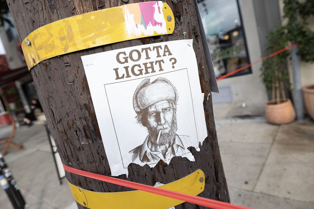 Utility Pole with a sketch of the Woodsman