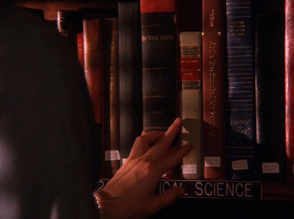 Audrey Horne running fingers along bookshelf