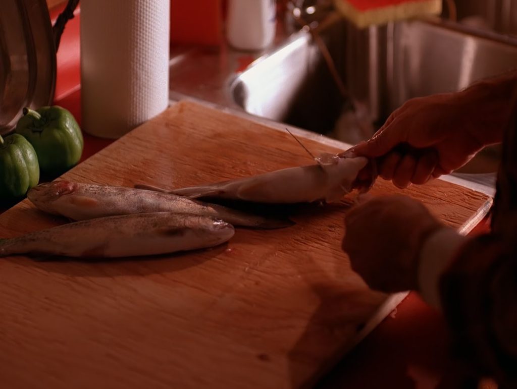 Pete Martell cutting fish