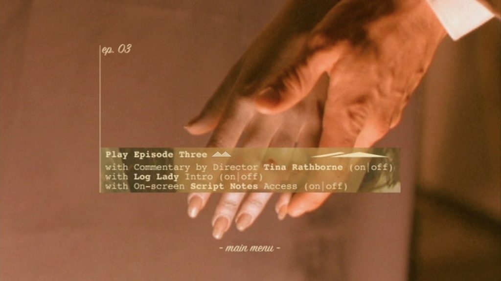 DVD Menu with an image of Agent Cooper holding Laura Palmer's hand in the morgue