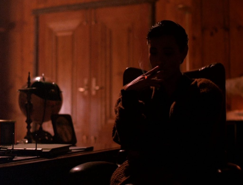 Shadow of Josie Packard smoking in Ben Horne's office