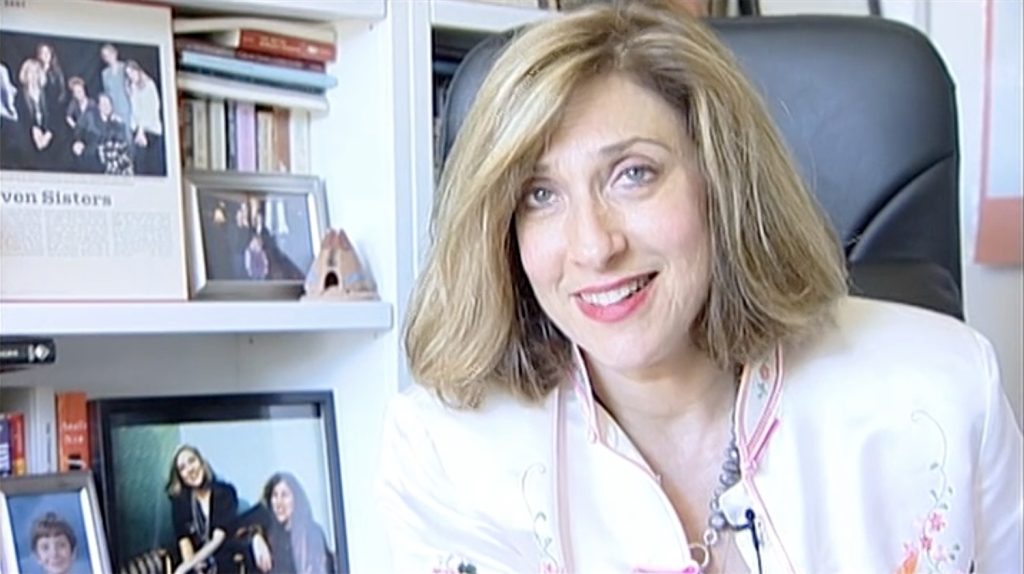 Lesli Linka Glatter sitting at a desk smiling