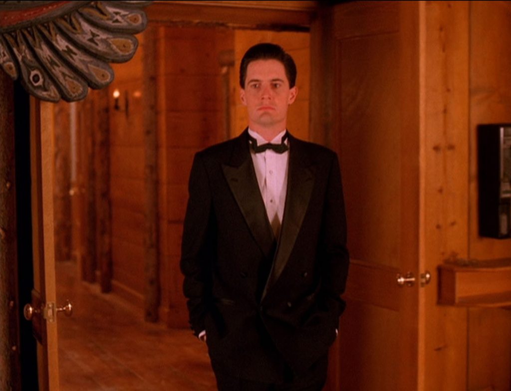 Special Agent Dale Cooper walking through The Great Northern Hotel in a tuxedo