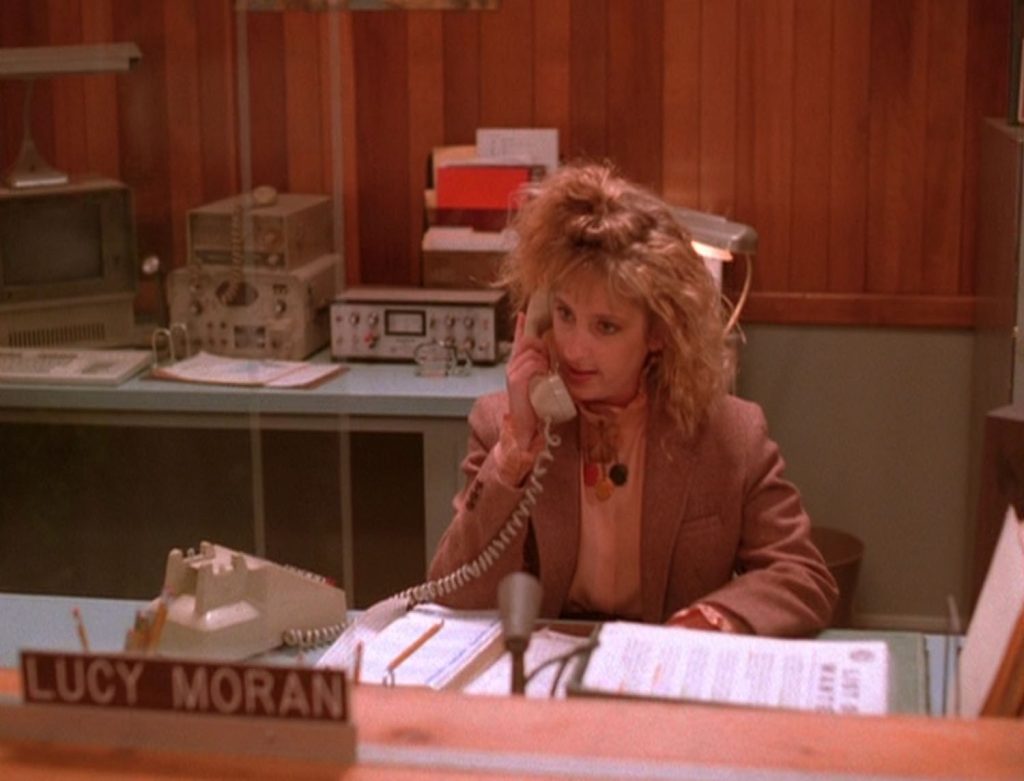 Lucy Moran on the phone at her desk