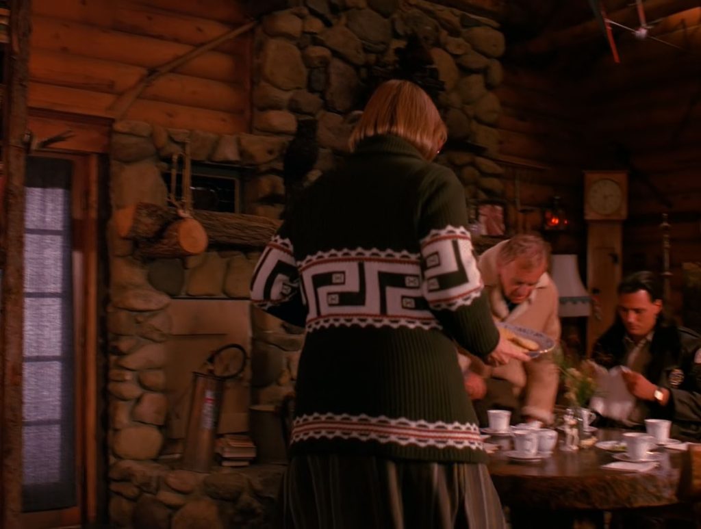 Log Lady carrying items to the dining room table