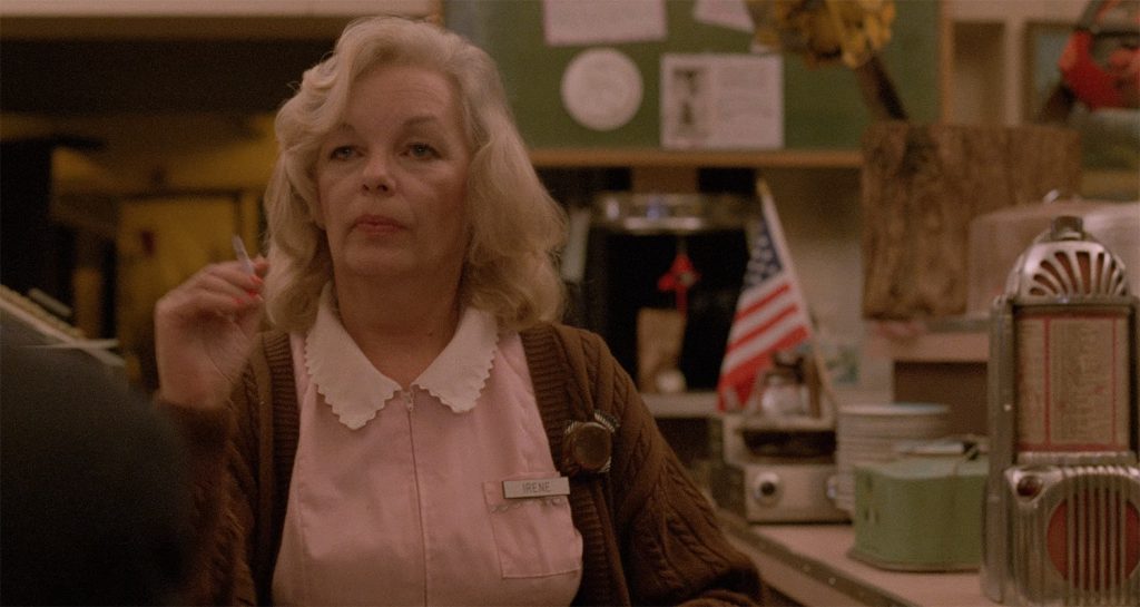 Irene standing behind the counter at Hap's Diner