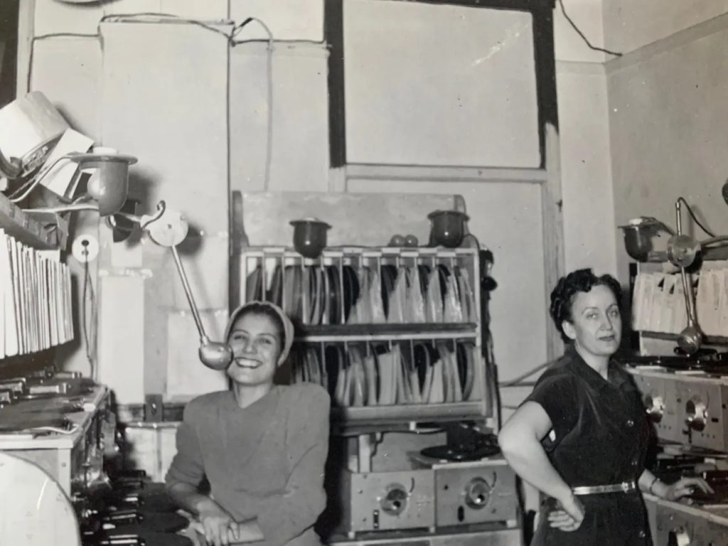 Women working at a multiphone station