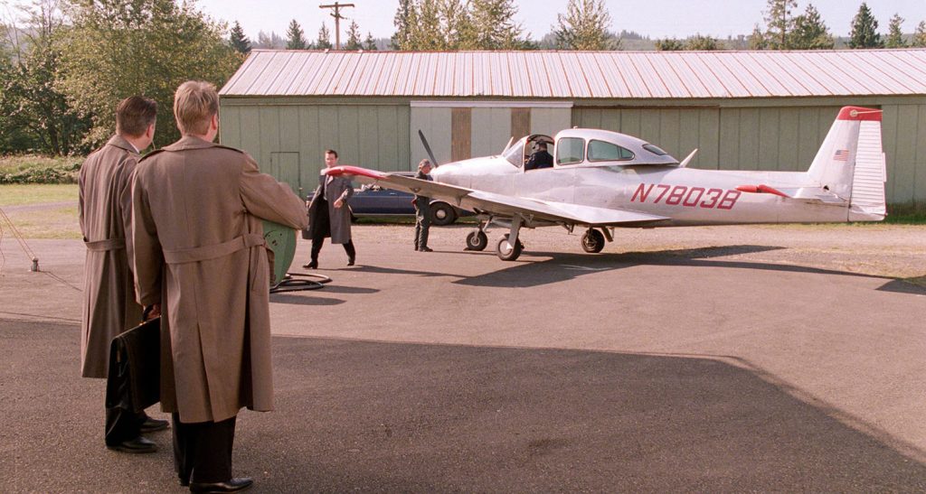 Agents Cole and Stanley at Private Portland Airport waiting for Chet Desomd to deplane