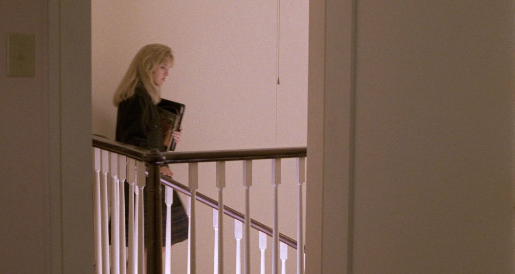 Laura Palmer descends a staircase