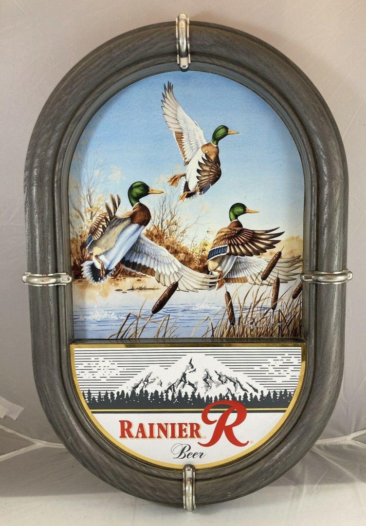 Oval Rainier Beer sign with Mallard artwork