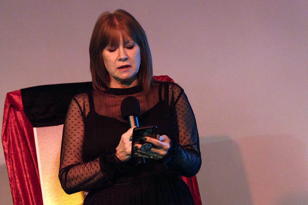 Anita Dunning-Rehn reading from a mobile phone