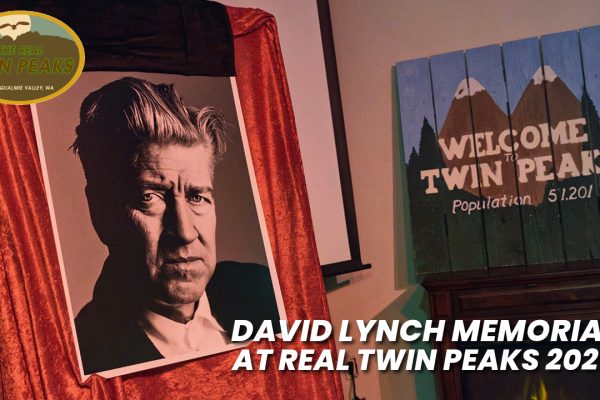 Image of David Lynch on a red-draped easel