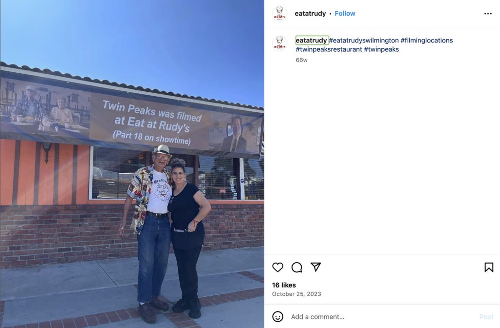 Instagram post with two people outside Eat at Rudy's
