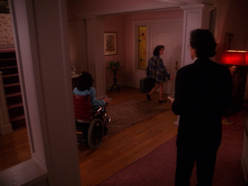 Donna Hayward leaving her home while family looks on