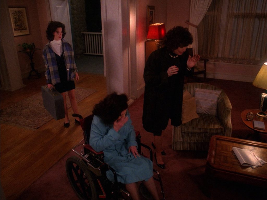 Donna Hayward leaving her home while family looks on