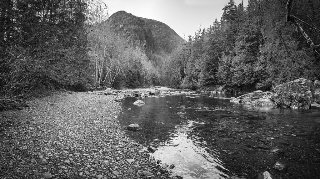 Black and white photo of Olallie Point mountain with the Snoqualmie River in the foreground