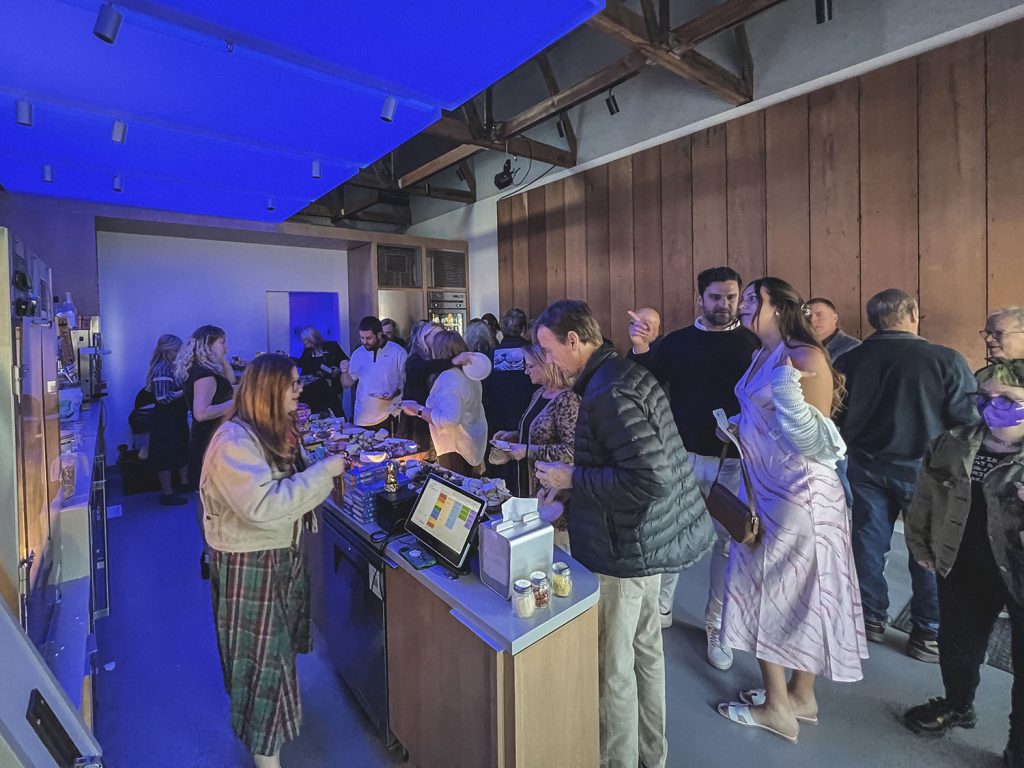 Ojai theatre lobby with people purchasing items at the concession stand