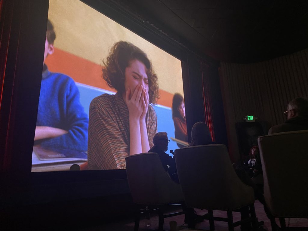 Movie screen with paused image of Donna Hayward