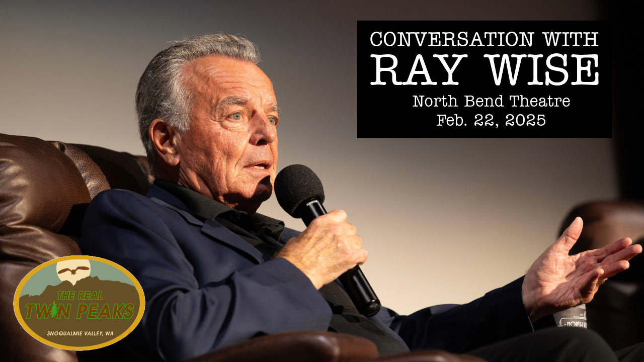 Ray Wise on stage speaking into a microphone